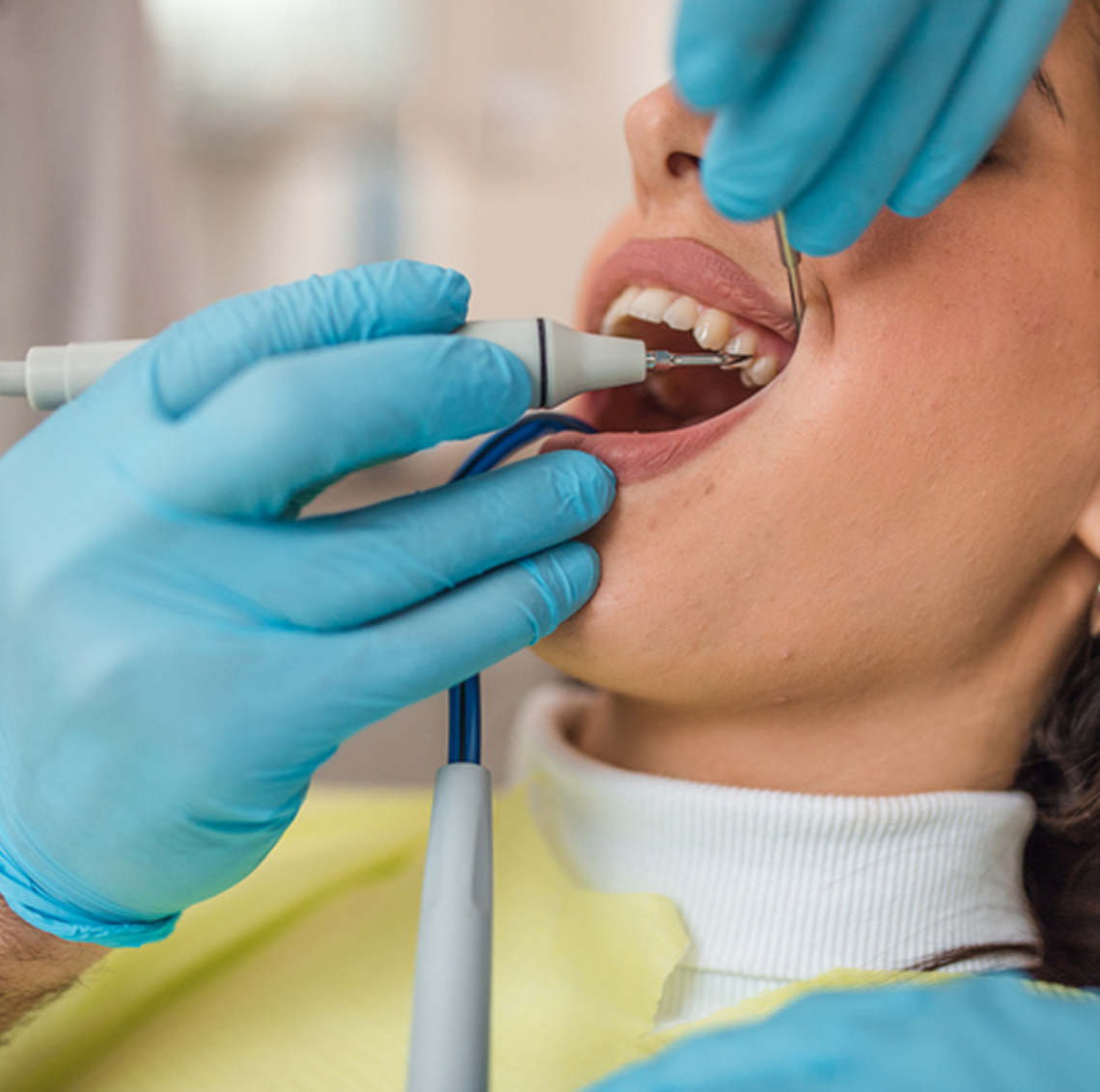 Dentist examining a patient's teeth