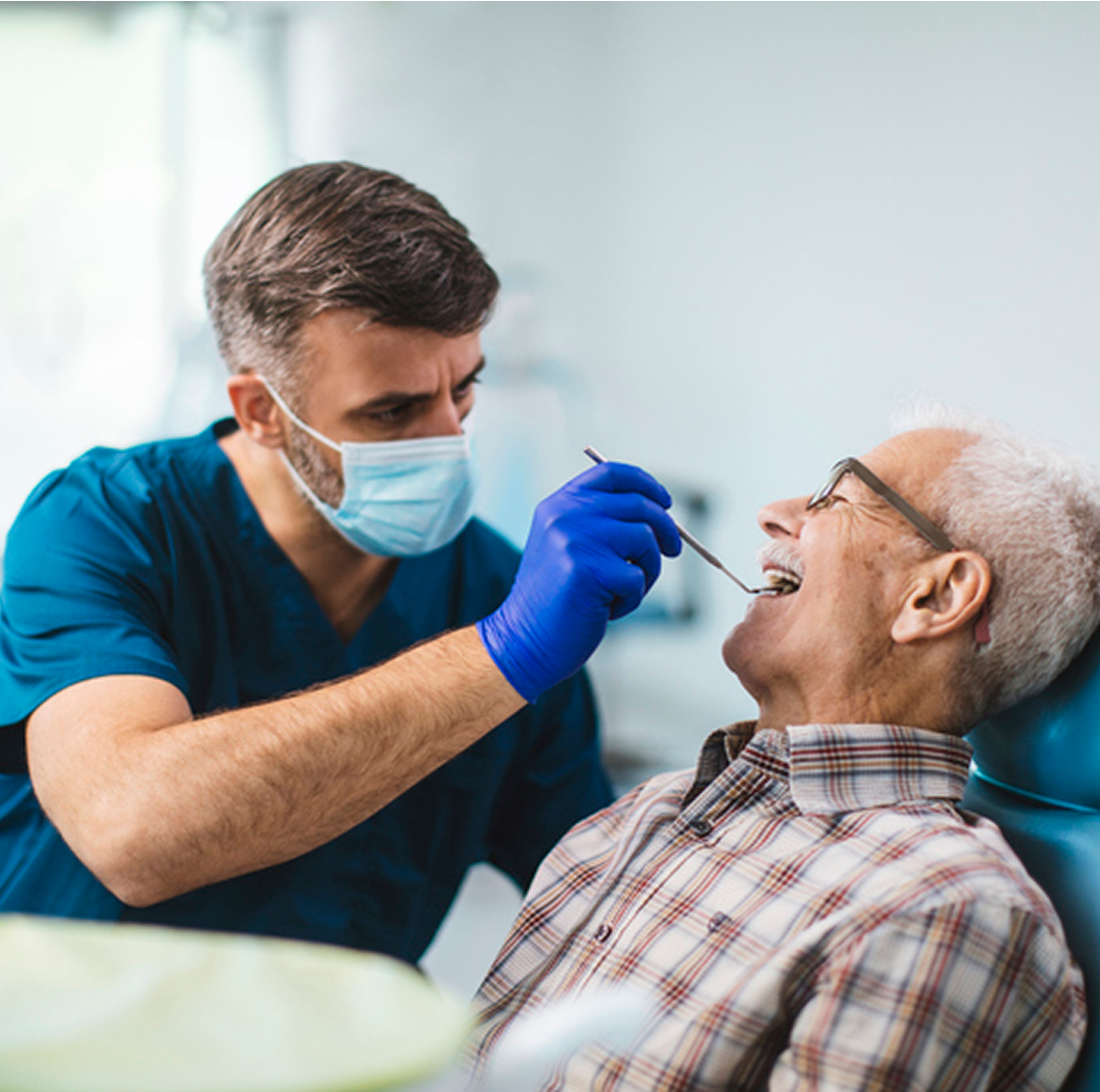 Senior man receiving dental checkup